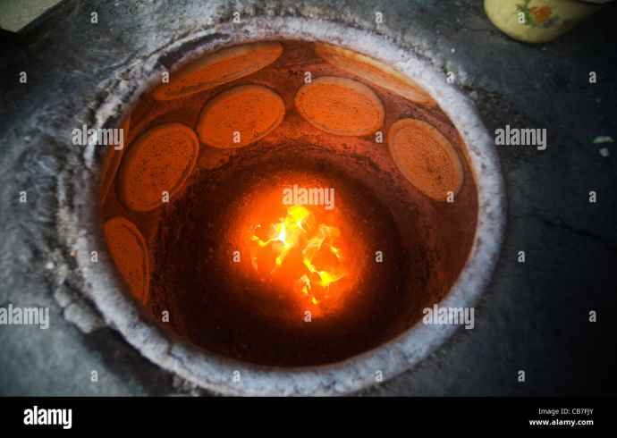 What is the traditional Indian method of cooking in a tandoor?
